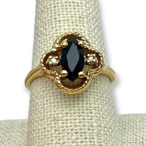 Vintage LIND Black Spinel & Diamond Gold Cocktail Ring with a quatrefoil setting